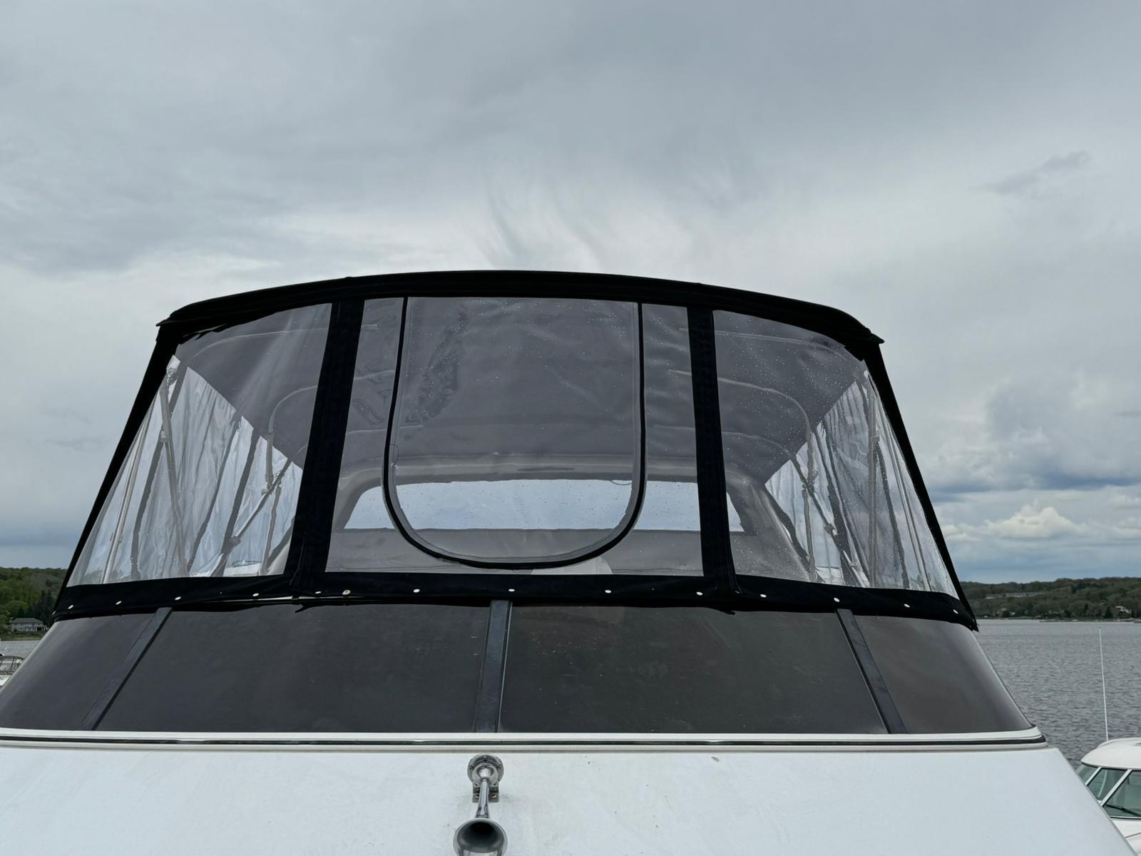 Custom bimini and enclosure over water