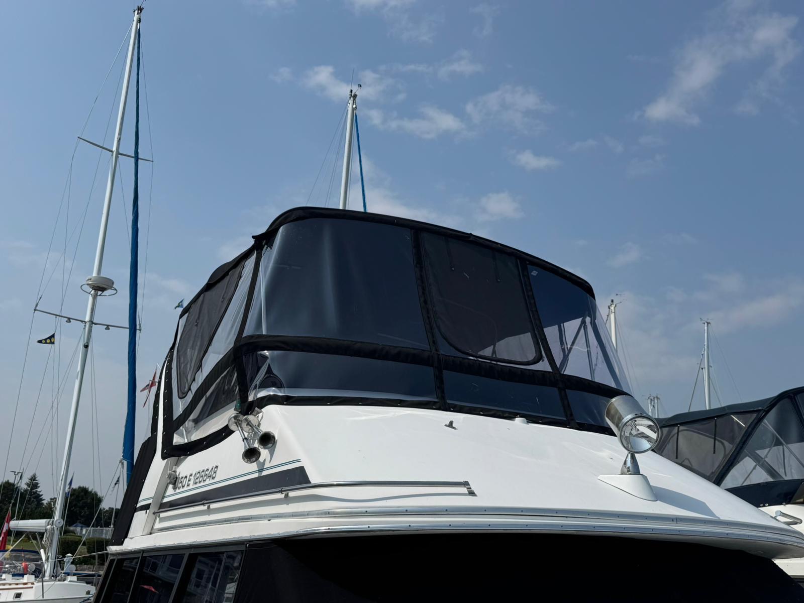 Custom boat enclosure with dodger at Krates Marina