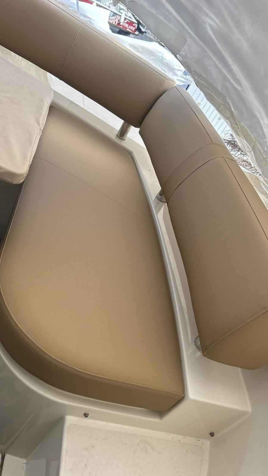 Finished beige cockpit seat re-upholstery installed