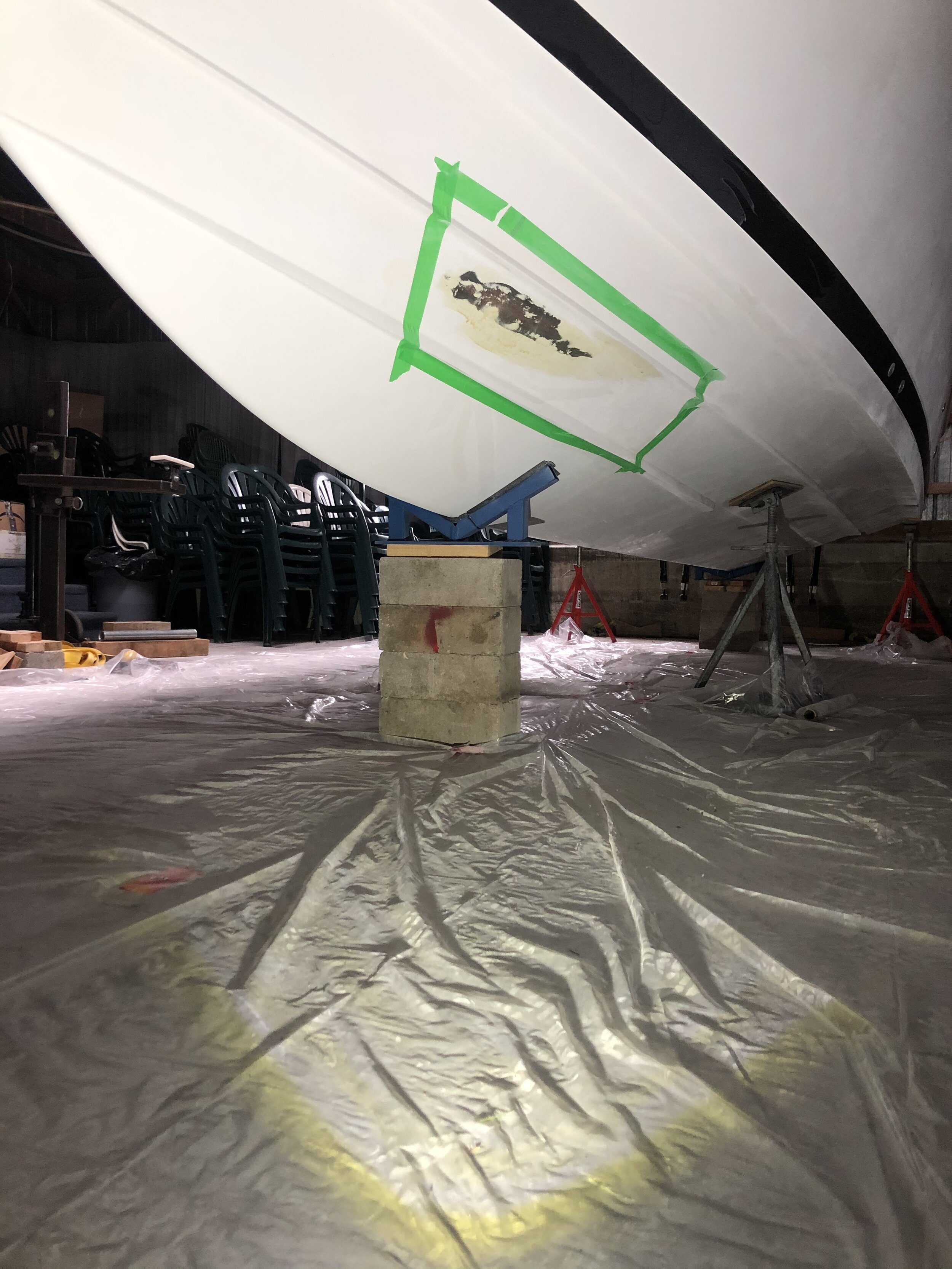 damage on the hull bottom taped off for repair